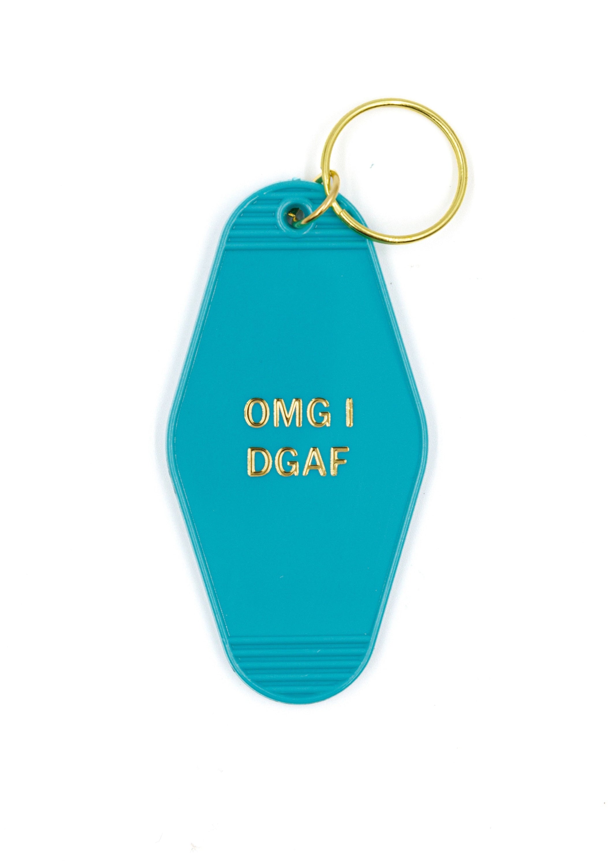 Aqua blue motel keychain with gold lettering saying 'OMG I DGAF', featuring a brass split ring.